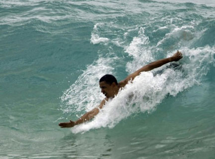 Obama body surfing at Sandy Beach