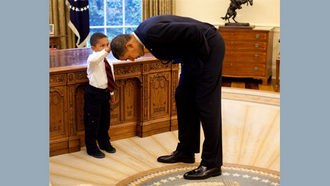 Obama bows down so boy can touch his hair 