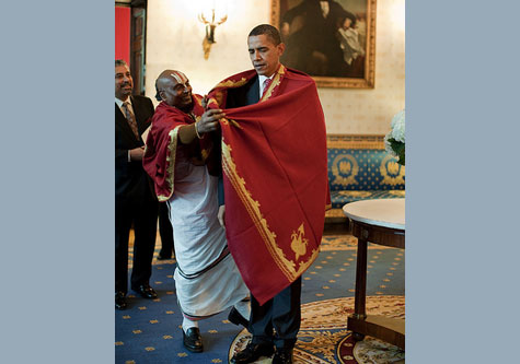 Obama wrapped in an African blanket