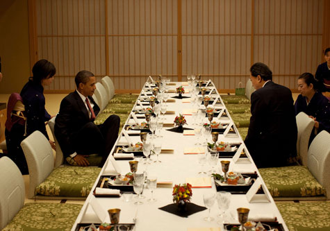Obama sitting at low dinner table in Japan