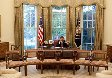 Obama on phone in Oval Office