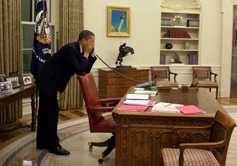 Obama with eyes closed in Oval Office 