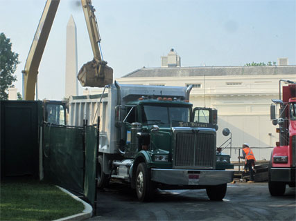Dump trucks remove dirt from White House