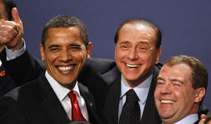 Berlusconi and Medvedev enjoy watching the recap of President's Obama's encounter with the Queen