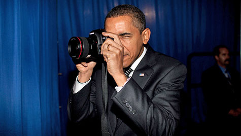 Obama holding a camera