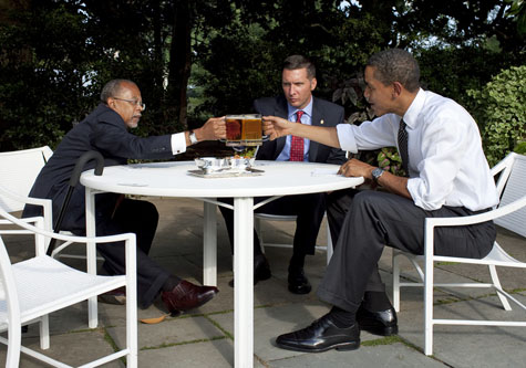 President Obama drinks a beer in the Rose Garden