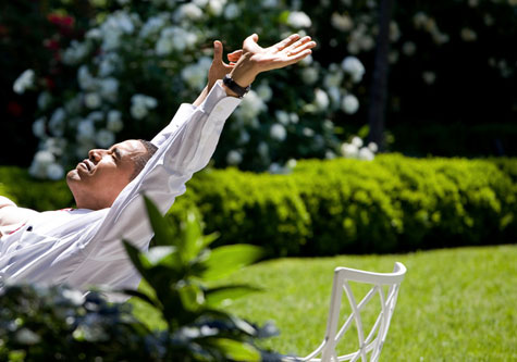 President Obama leans back in the sun and dreams of Hawaii