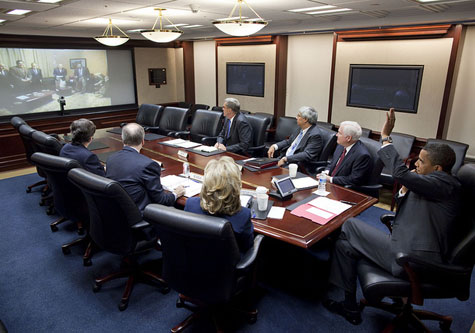 President Obama waves in the White House Situation Room 