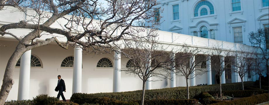 President Obama walking to the Oval Office outside the White House - West Wing Colonnade